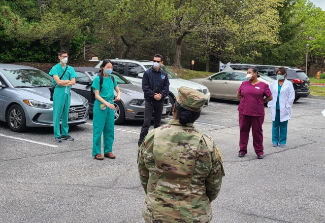 Provider team in front of soldier