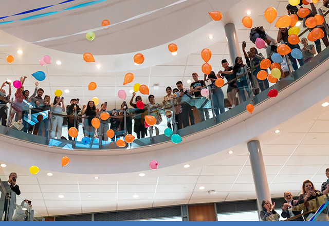 Students smile and share their matches for Match Day.