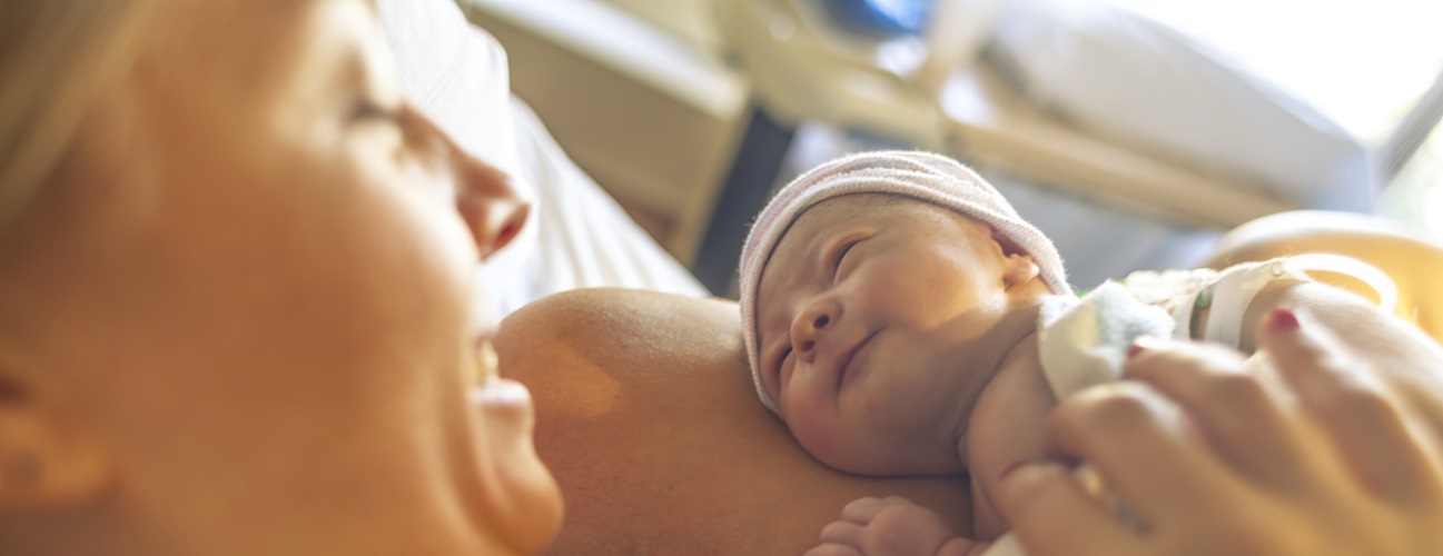 woman holding newborn baby